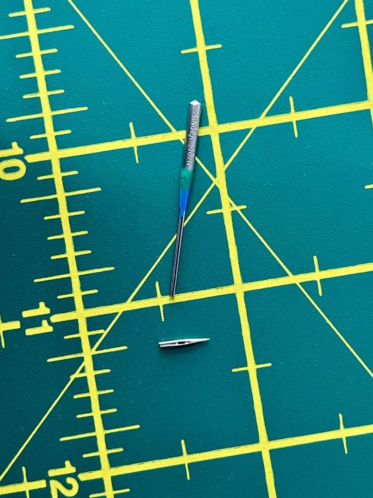 A broken ballpoint needle