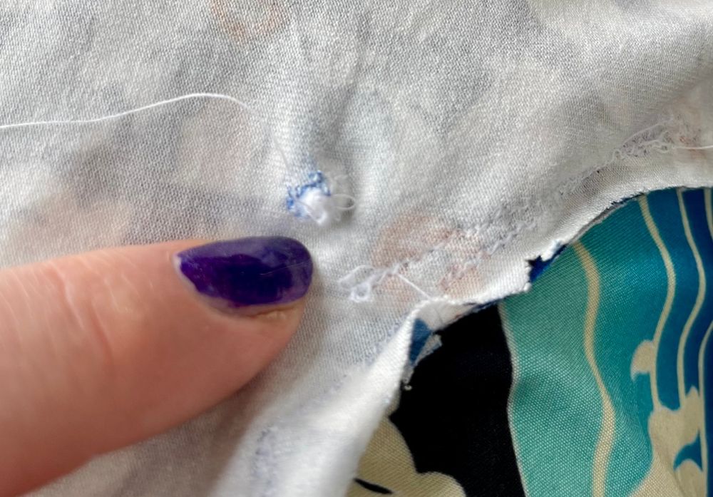 A bunch of thread bundled up in the fabric due to sewing error